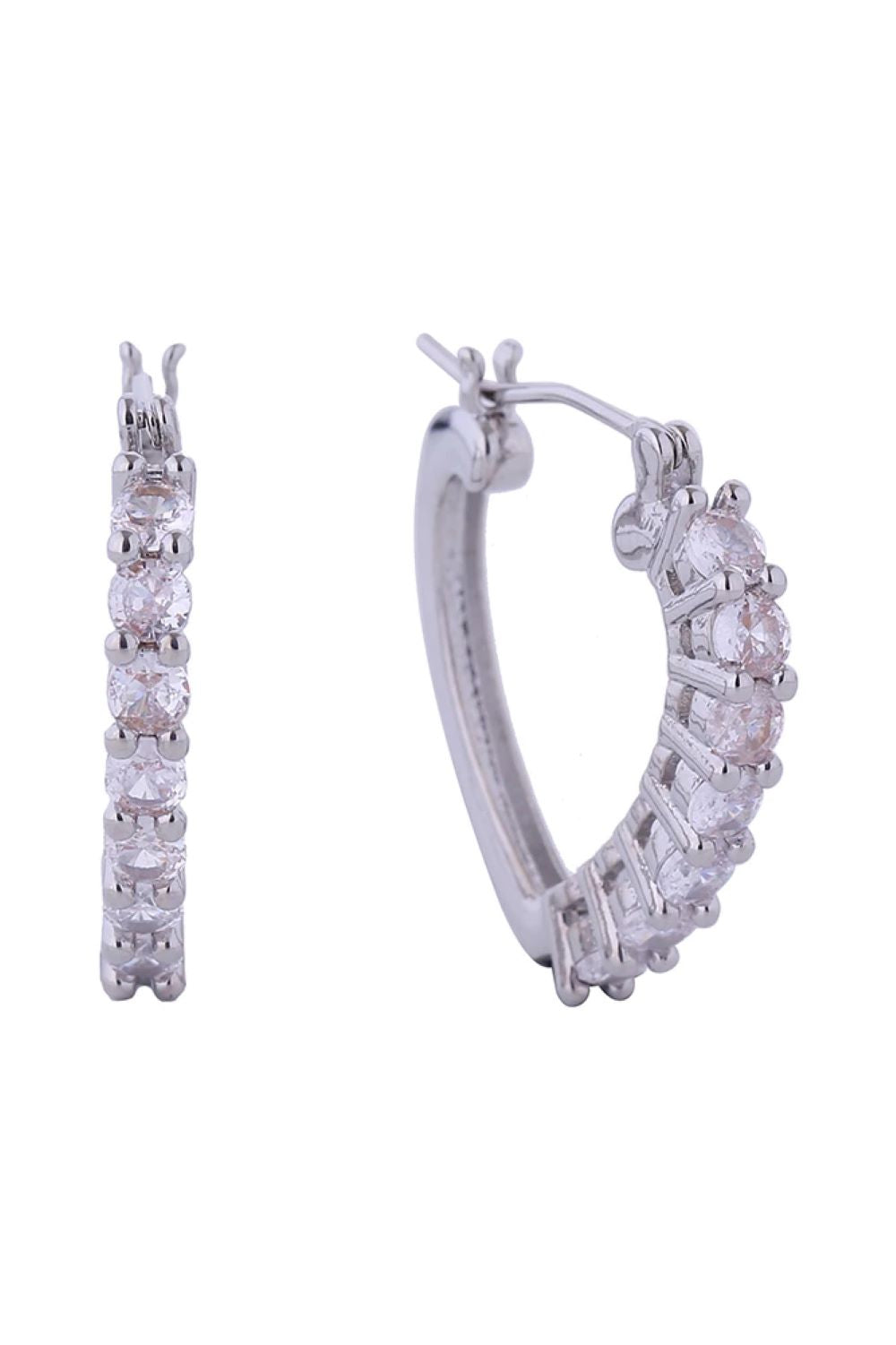 White Gold Delicate cupid-shaped earrings featuring sparkling cubic zirconia pavé detailing. Crafted from brass with 14K gold or white gold dipping for a luxurious finish. The secure pincatch backing ensures all-day comfort and stability. Hypoallergenic design makes these earrings perfect for sensitive ears. Lead and nickel compliant for peace of mind. Measuring 2.3cm in diameter, they offer a refined, wearable size that complements any look.