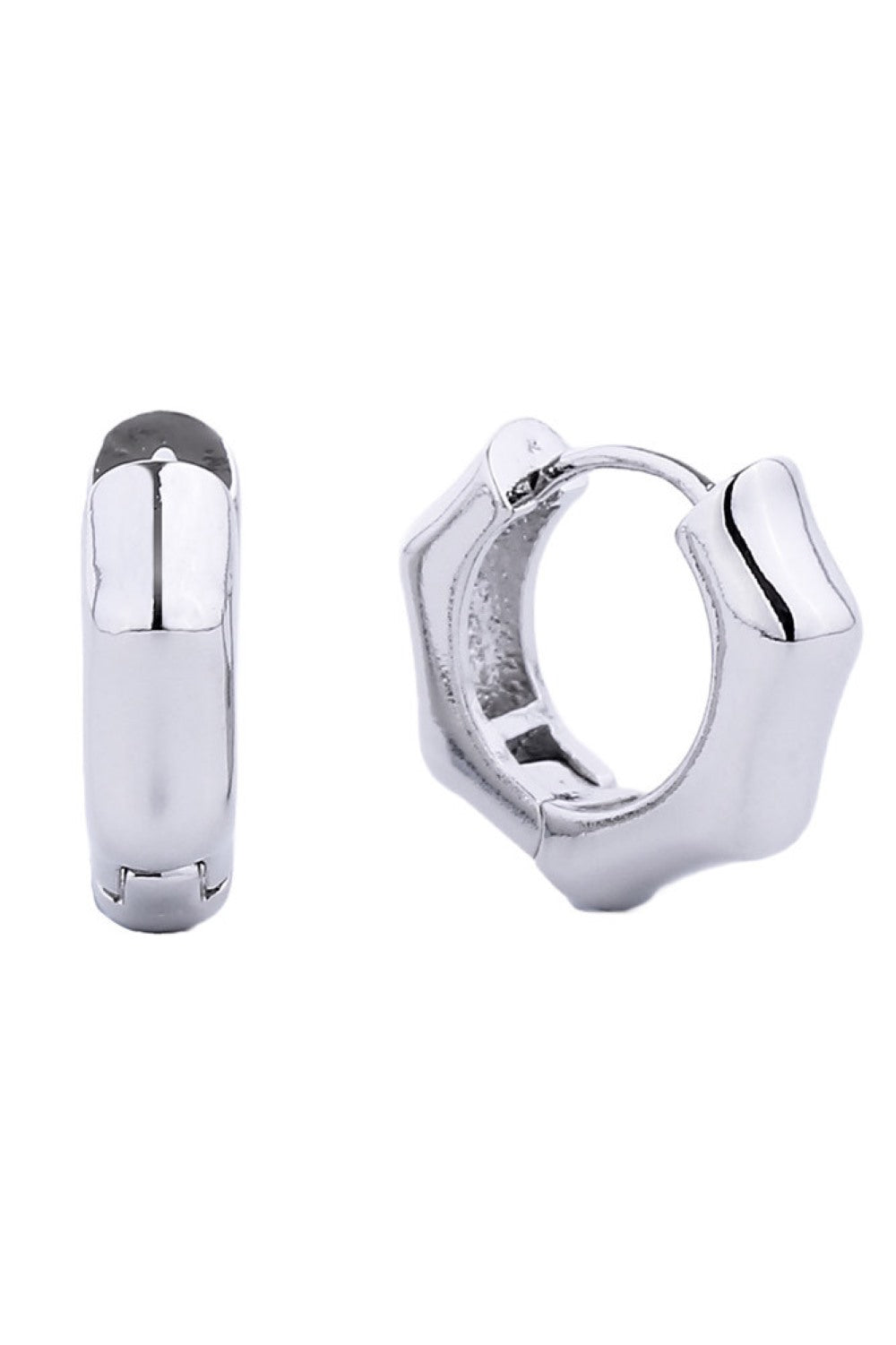 White Gold Delicate and timeless, these 14K gold dipped huggie hoop earrings offer everyday elegance in a compact 1.4cm diameter. Crafted from hypoallergenic brass, they're gentle on sensitive skin while delivering a luxurious gold finish. Lead and nickel compliant for peace of mind. Perfect for layering or wearing solo, these versatile hoops complement any style.