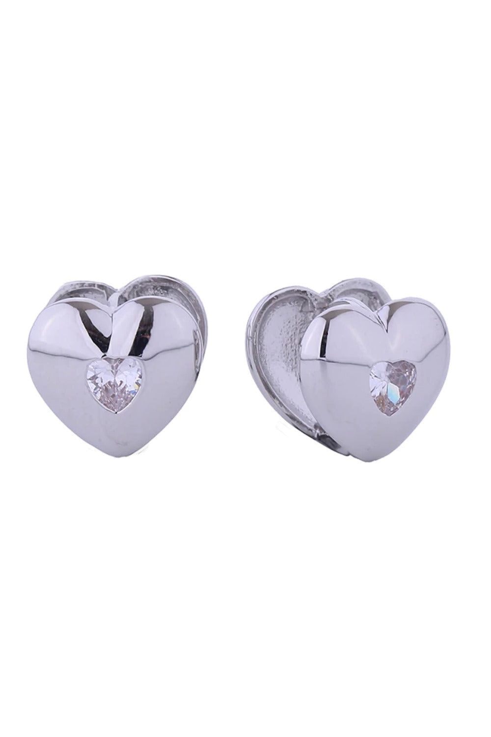 White Gold Delicate double heart huggie earrings crafted in 14K gold or white gold-dipped brass. Hypoallergenic design with sparkling cubic zirconia accents. Measuring 1.3cm in diameter, these charming earrings hug the earlobe for a secure, comfortable fit. Lead and nickel compliant for sensitive skin. Expertly made in Korea. Perfect for everyday elegance or layering with other pieces.