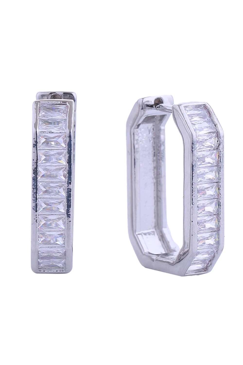 White Gold Elevate your everyday elegance with these stunning 14K Gold/White Gold Dipped Huggie Earrings. Featuring a luxurious emerald center stone surrounded by sparkling cubic zirconia pavé detailing, these versatile beauties work seamlessly from day to night. Crafted from hypoallergenic brass with a premium gold dip finish, they're gentle on sensitive ears while delivering maximum sparkle. At 2.4cm in diameter, the perfect size for a subtle yet sophisticated statement.