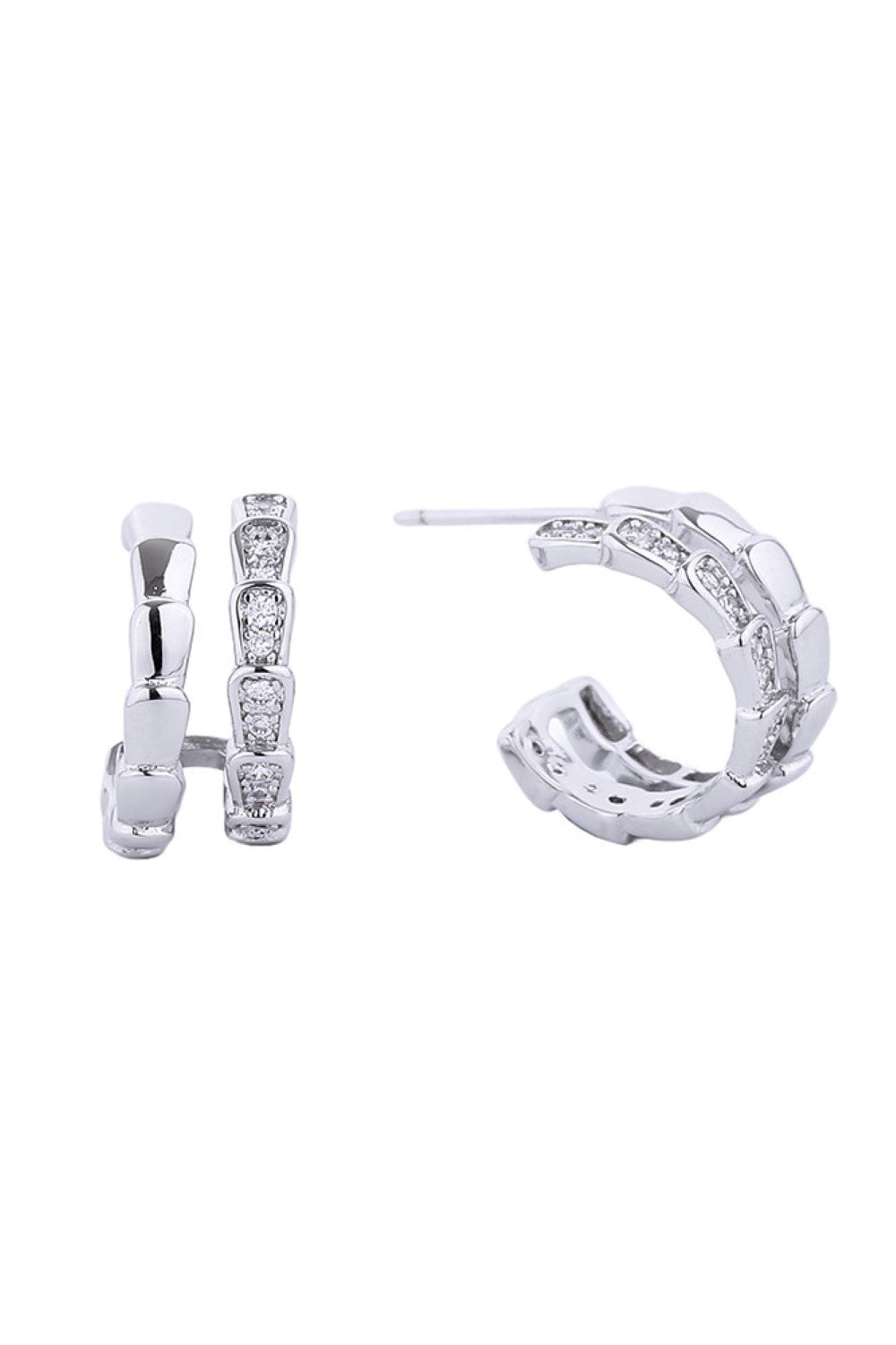 White Gold Elegant post hoop earrings featuring a lustrous 14K gold and white dip finish. Each piece is adorned with cubic zirconia pavé detailing for a sparkling, sophisticated look. Crafted from hypoallergenic brass, these earrings are gentle on sensitive skin. With a delicate 1.52cm diameter, they offer the perfect balance of presence and wearability. Lead and nickel compliant for safe, worry-free wear.