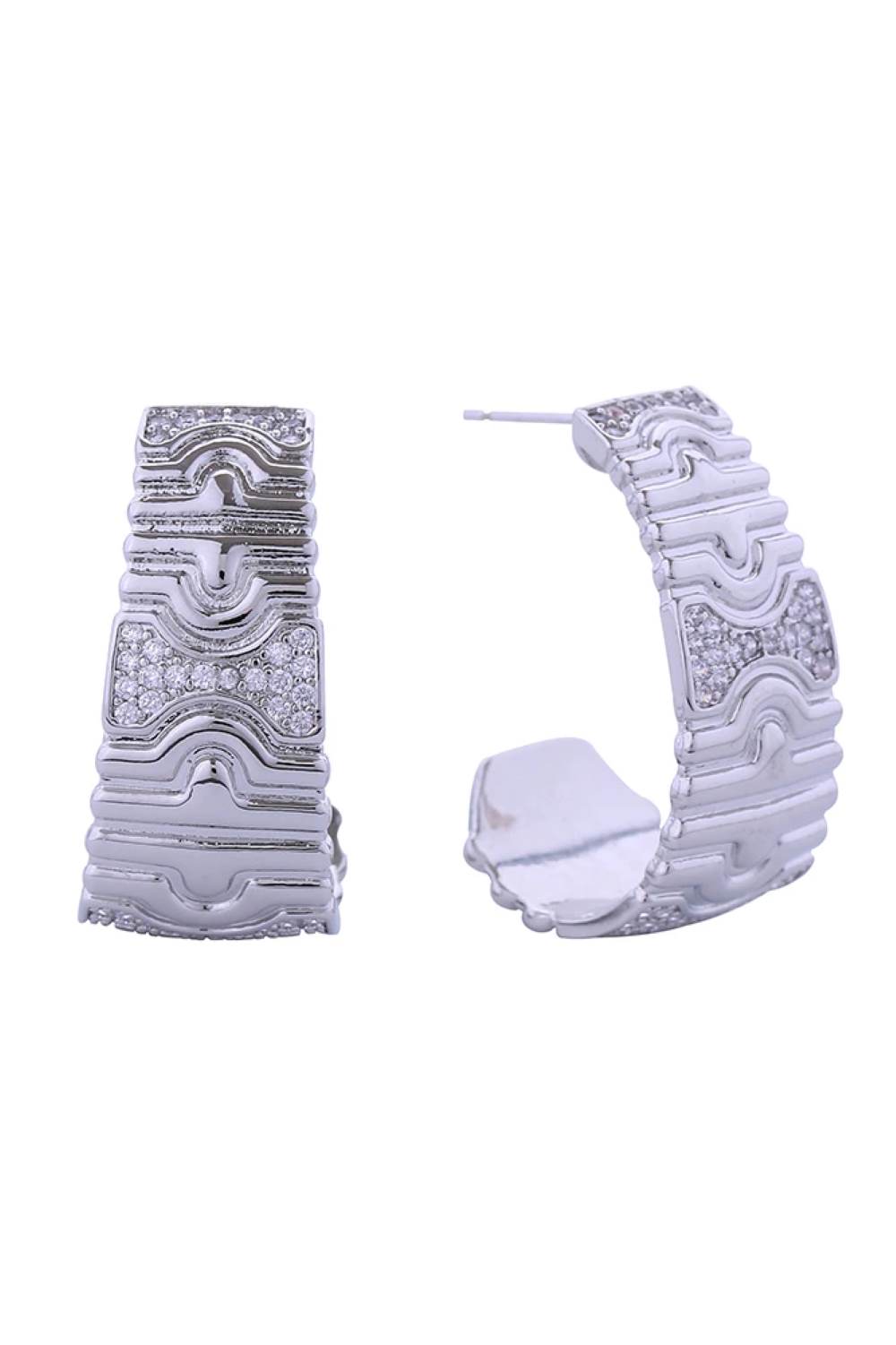 White Gold Elevate your everyday elegance with these stunning 14K Gold/White Dipped Serpent Pave CZ Post Earrings. Crafted from quality brass and adorned with sparkling cubic zirconia stones, these earrings feature an intricate serpent design that catches the light beautifully. Measuring 2.8cm in diameter, they offer the perfect balance of presence and wearability. The hypoallergenic construction makes them ideal for sensitive ears, while the lead and nickel-compliant materials ensure safety and peace of mi