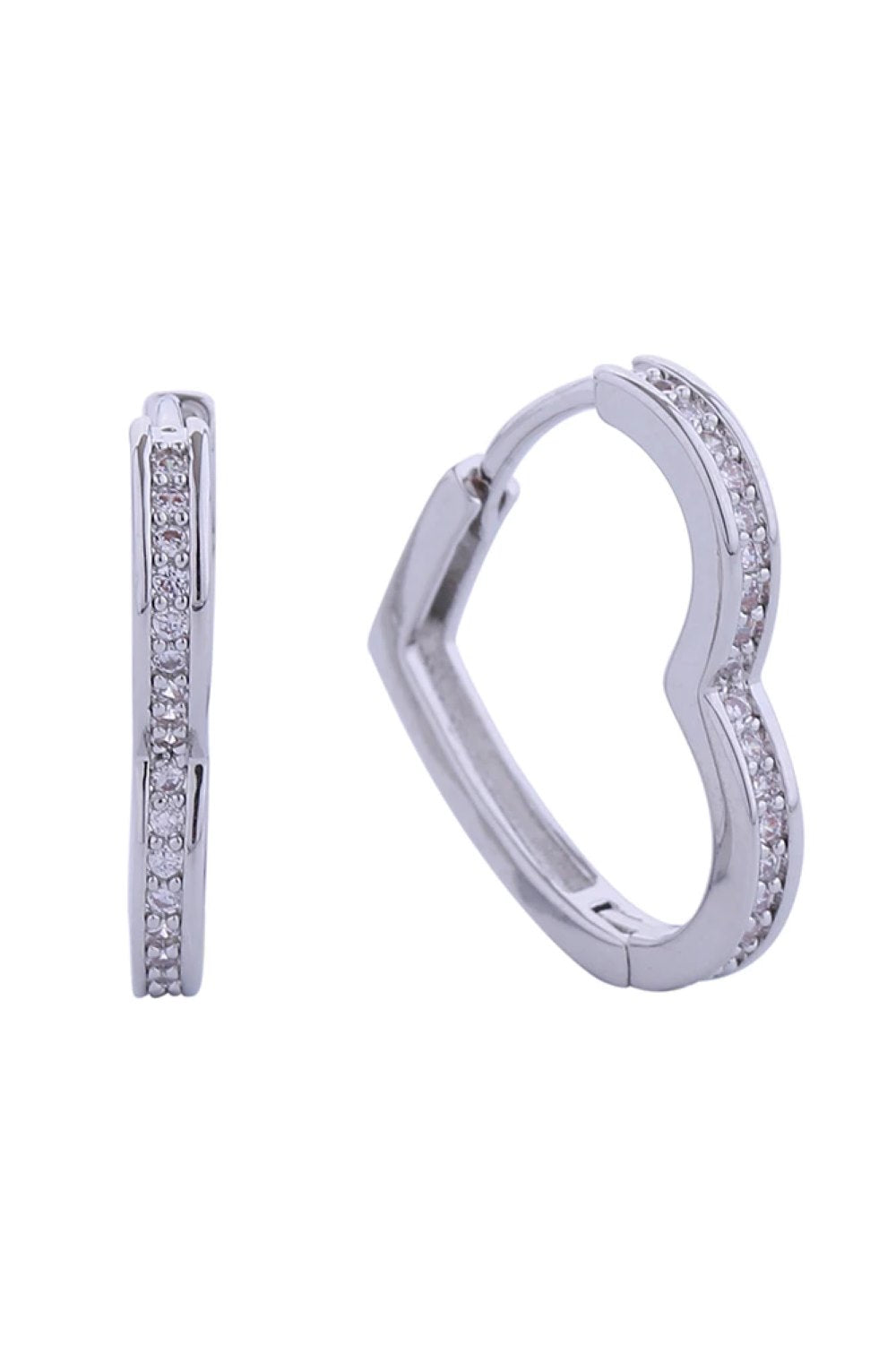 White Gold Elegant huggie earrings featuring a sleek heart design adorned with sparkling cubic zirconia pavé detailing. Crafted from brass with 14K gold or white gold dipping for a luxurious finish. These hypoallergenic earrings are perfect for sensitive ears and comply with lead and nickel safety standards. Measuring 1.8cm in diameter, they offer a delicate yet eye-catching look suitable for everyday wear or special occasions. Expertly made in Korea with attention to quality craftsmanship.