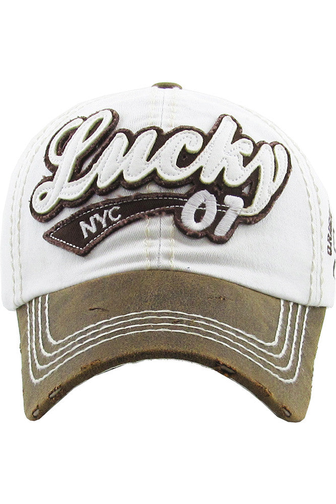 White The LUCKY Vintage Baseball Cap offers a soft washed finish with subtle distressing for an effortlessly cool, worn-in look. Designed for comfort and everyday style, it’s perfect for casual outings, travel days, or adding lucky vibes to any outfit.