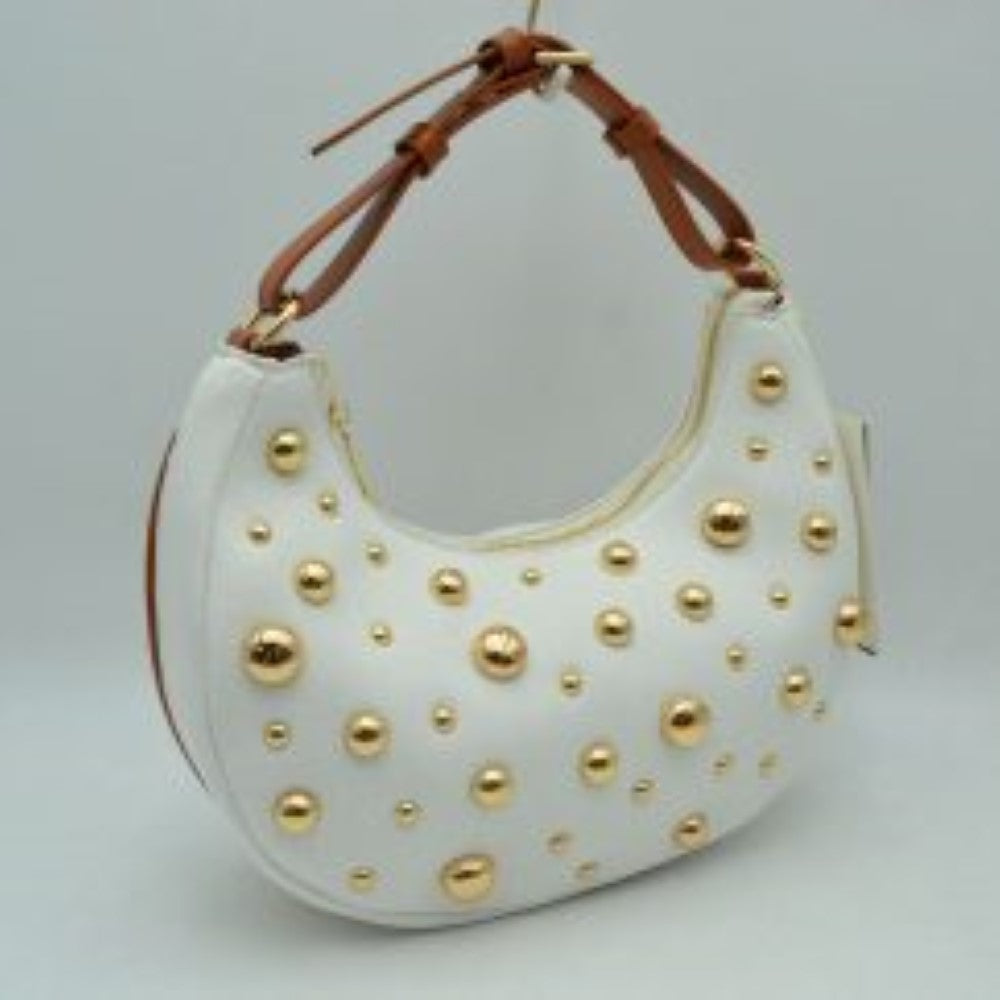 White This crescent-shaped handbag features a curved silhouette adorned with scattered, multi-sized metallic studs across the front surface. It is designed with a single, matching top handle attached via hardware rings, which includes integrated loops suggesting an adjustable style for versatile carrying. The top opening follows the contoured shape of the bag, providing access to the main storage compartment to keep everyday essentials secure.