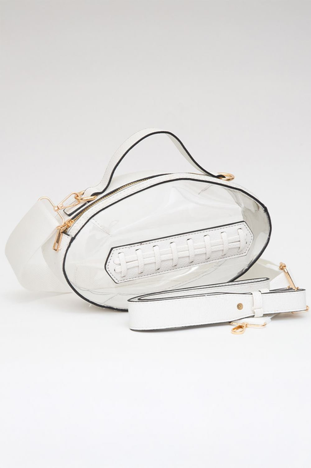 White Carry your essentials in style with this unique football-shaped transparent crossbody bag. Perfect for stadium events, concerts, and outdoor gatherings, the clear PVC design lets you see everything inside while meeting venue security requirements. Measuring 11" x 6" x 4", it offers practical storage without bulk. The adjustable crossbody strap keeps your hands free, making it ideal for busy days out. Durable 100% PVC construction ensures long-lasting wear through countless adventures.