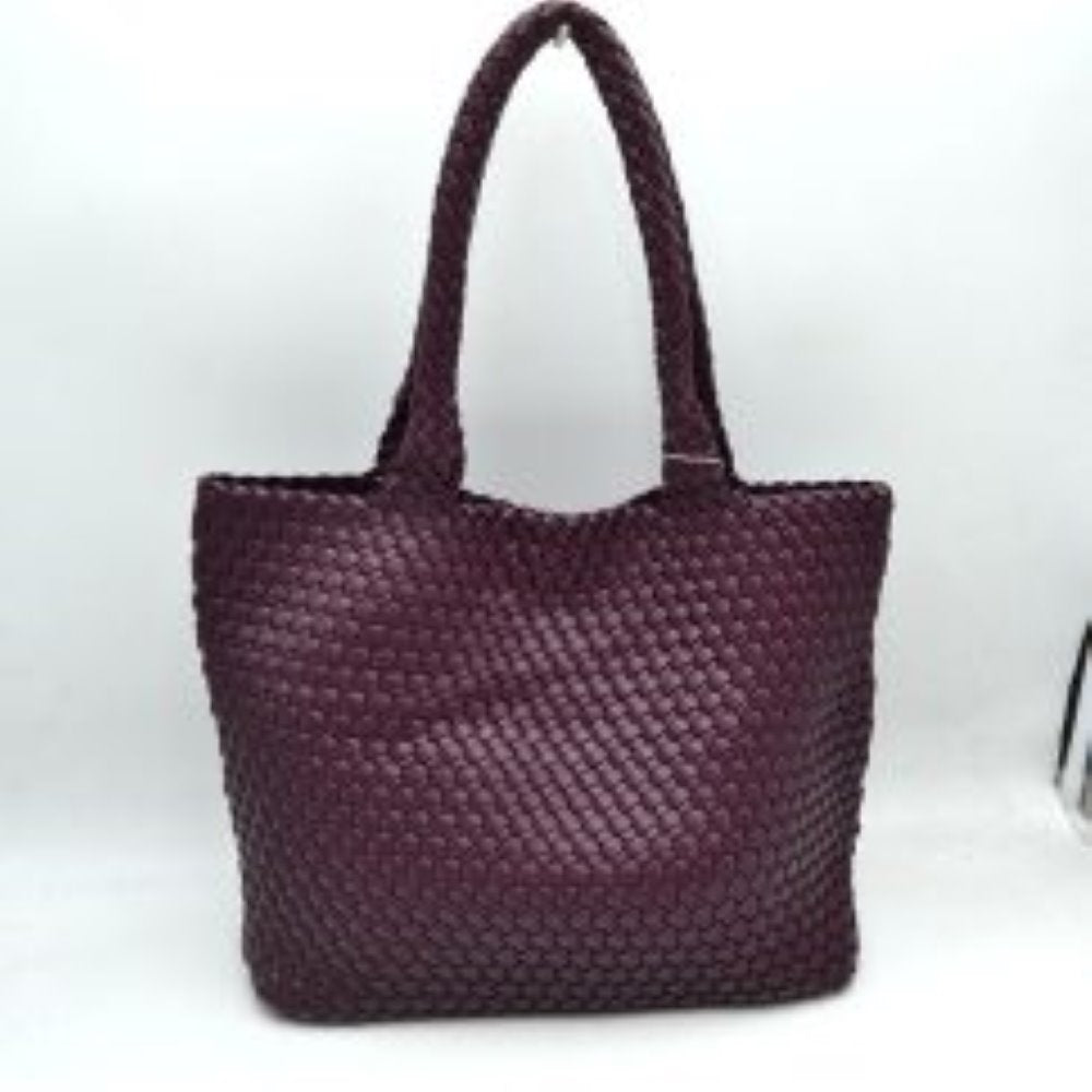 Wine This structured tote bag features an intricate basket-weave design across its body and integrated shoulder straps, creating a textured look suitable for everyday use. The main storage compartment offers a wide, open-top design for easy access to daily essentials. Accompanying the larger bag is a matching smaller pouch with a distinct woven exterior pattern and a secure gold-tone top zipper closure to keep smaller items organized.