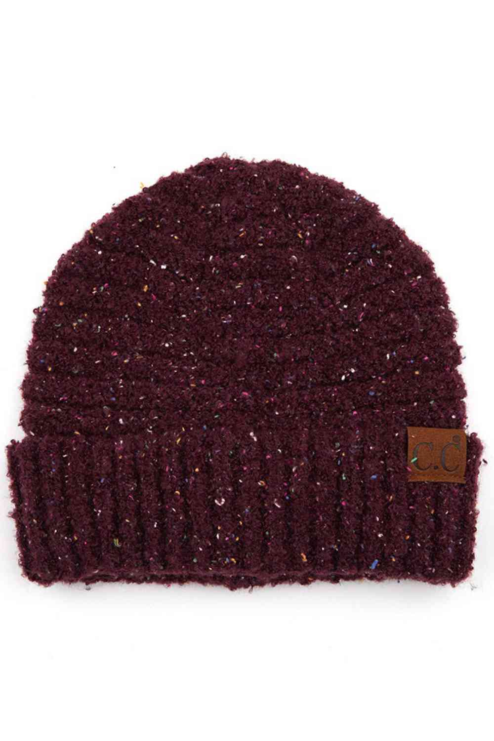 Wine Elevate your winter wardrobe with this C.C Confetti Boucle Yarn Beanie, crafted from a premium blend of 95% polyester and 5% cotton. The textured boucle yarn creates visual interest and dimension, making it the perfect accessory to complement any outfit.