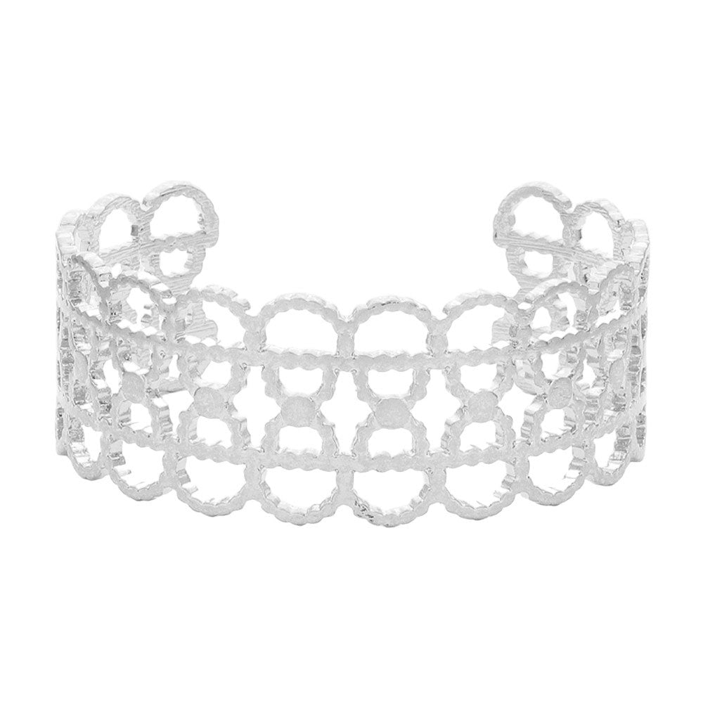 Worn Silver Textured Metal Open Oval Cuff Bracelet. This elegant piece features a unique textured design and an open oval shape, making it perfect for adding a touch of sophistication to any outfit. Crafted with quality metal, it is durable and comfortable to wear. Elevate your fashion game with this statement piece.