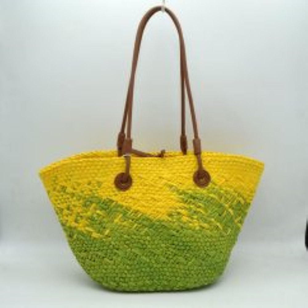 Yellow This everyday tote bag features a spacious, flared silhouette with a distinctive textured, woven pattern throughout the body. Designed for convenient daily carrying, it comes equipped with dual long, slim shoulder straps secured to the panels via tonal circular stitched anchors. The open top design reveals a central loop fastening detail along the upper rim, offering a minimalist accent to the generous main storage compartment
