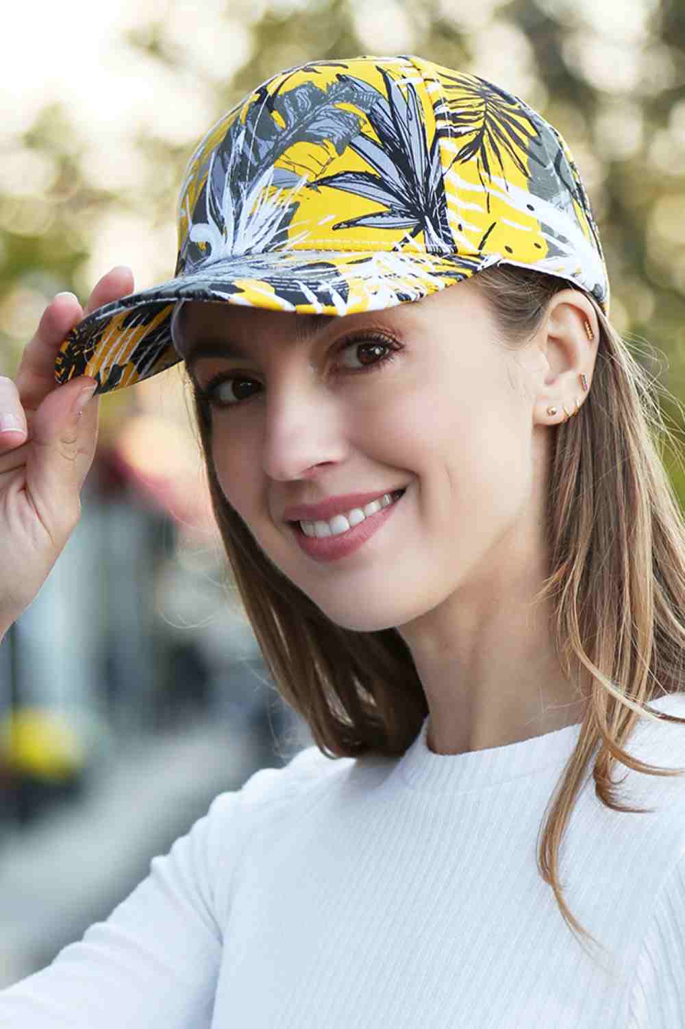 Yellow The Leaves Print Baseball Cap features a stylish all-over leaf pattern that adds a fresh, nature-inspired touch to any casual outfit. Made from lightweight, breathable fabric with an adjustable strap, it offers comfortable all-day wear and a secure fit.