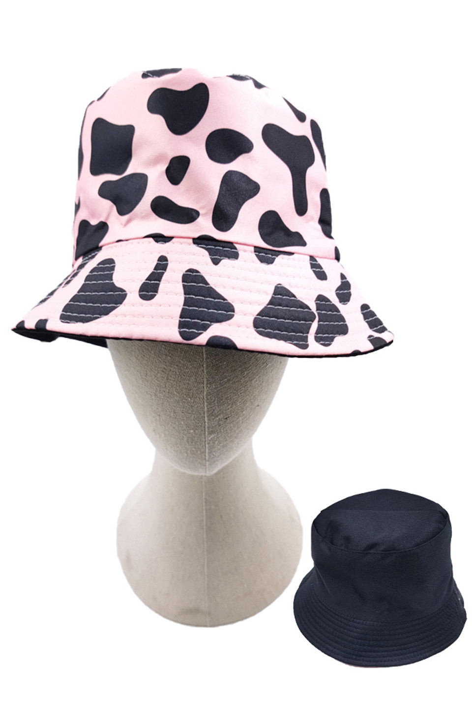 Pink Cow Print Reversible Bucket Hat features a precisely rendered cow print pattern with carefully calculated spot distribution for maximum visual definition. Constructed using advanced textile composites that deliver exceptional UV protection while maintaining optimal thermal regulation properties. Reinforced seam architecture ensures dimensional stability throughout repeated wear cycles, while the structurally engineered brim provides consistent shade coverage without compromising integrity.