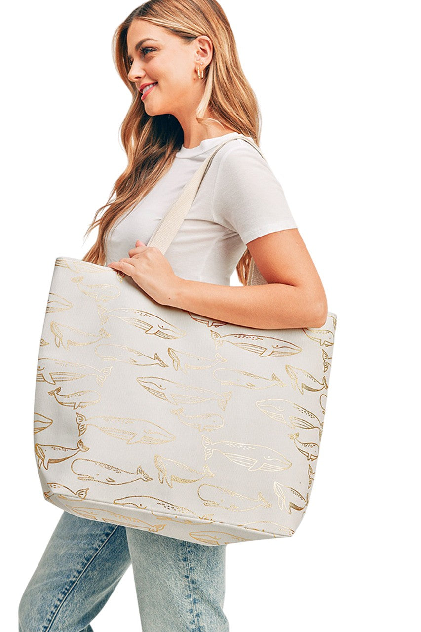 Gold Foil Whale Tote Bag showcases a refined design with a shimmering gold whale motif, expertly printed to ensure lasting vibrancy. Constructed from durable fabric, this tote provides generous capacity for daily essentials while maintaining a sleek profile. Ideal for those who appreciate both functionality and distinctive style, it offers a sophisticated accessory suitable for various occasions.