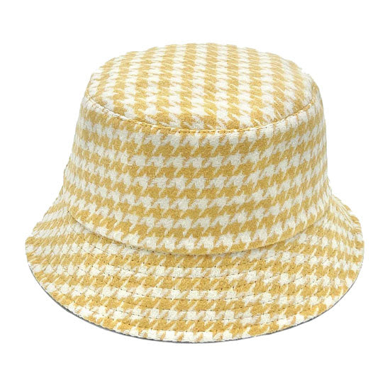 Yellow Polyester Houndstooth Patterned Bucket Hat, this bucket hat doubles as a rain hat and is snug on the head and stays on well. It will work well to keep the rain off the head and out of the eyes and also the back of the neck. Wear it to lend a modern liveliness above a raincoat on trans-seasonal days in the city.