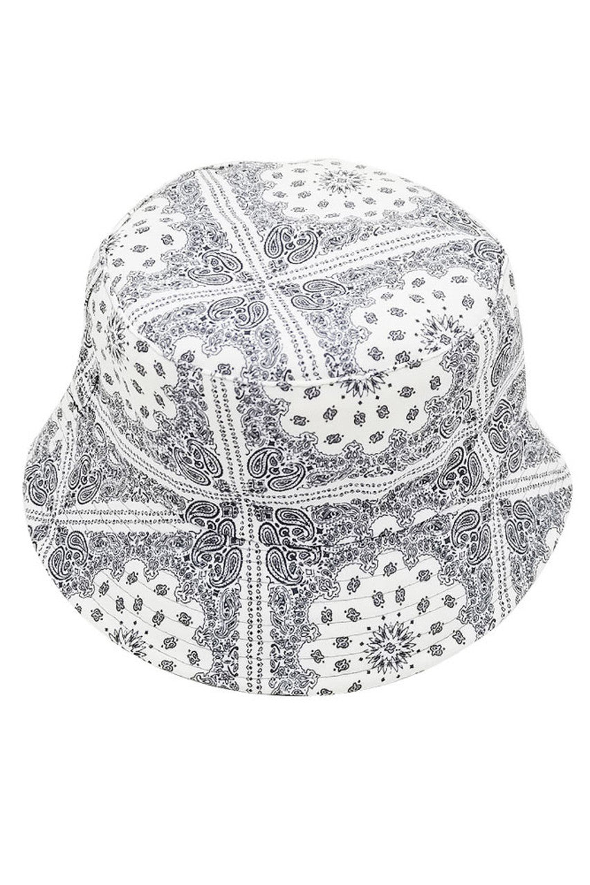 White PAISLEY PRINT BUCKET HAT features an elaborate swirling pattern executed with technical precision. The structured crown and flexible brim offer optimal facial coverage while maintaining a fashion-forward silhouette. Engineered with superior materials for enhanced breathability and shape retention, making it an essential accessory for discerning style enthusiasts.