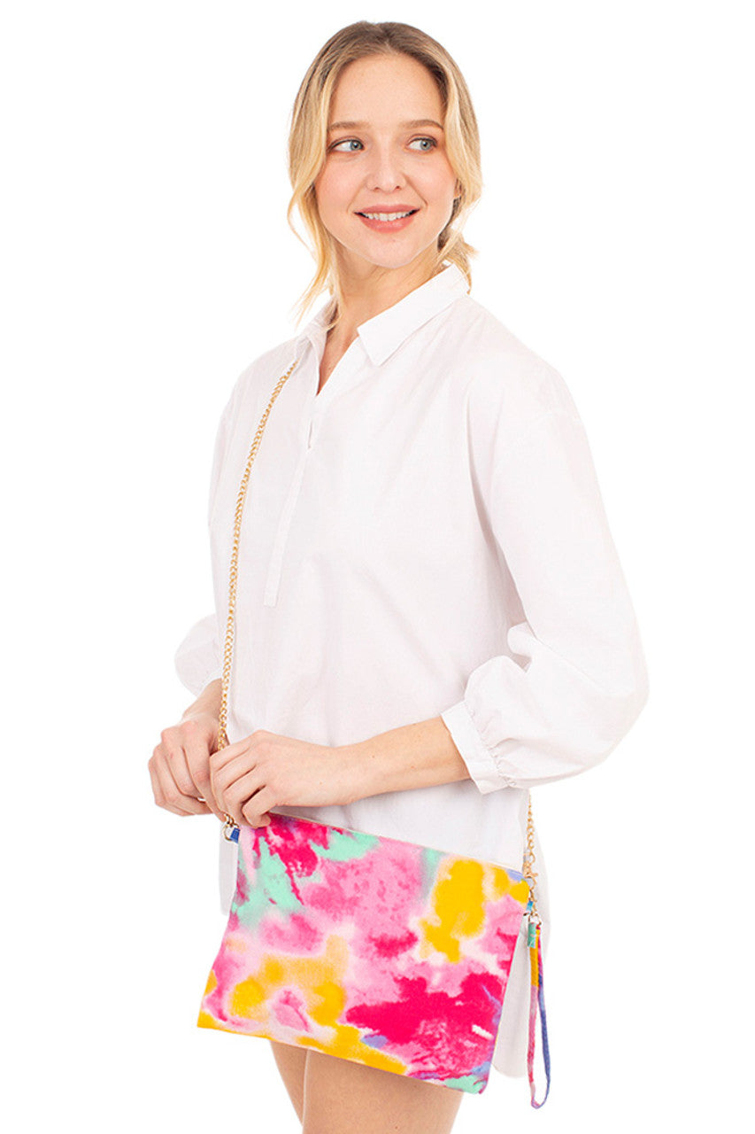 Tie Dye Cross Body Bag combines vibrant, eye-catching colors with practical design. Crafted for hands-free convenience, it features an adjustable strap for a comfortable fit and ample space to carry essentials securely. Perfect for adding a stylish, artistic touch to everyday outfits while keeping your belongings organized and accessible.