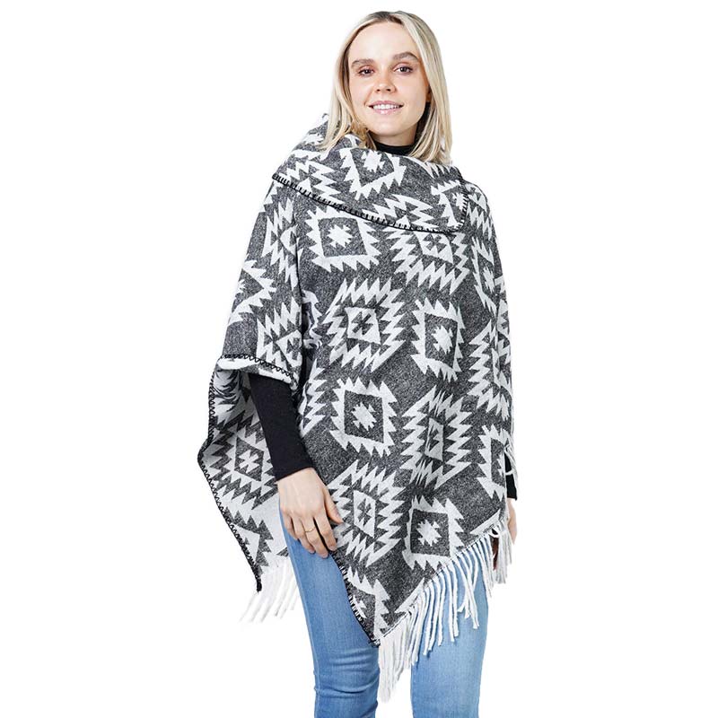 Black Western Pattern Tassel Poncho, is beautifully designed with different attractive colors that brings out the luxe into your look. Can be paired with so many tops. It ensures your upper body stays perfectly toasty when the temperatures drop. It's Lightweight and Breathable Fabric, Comfortable to Wear. It gently nestles around the neck and feels exceptionally comfortable to wear.