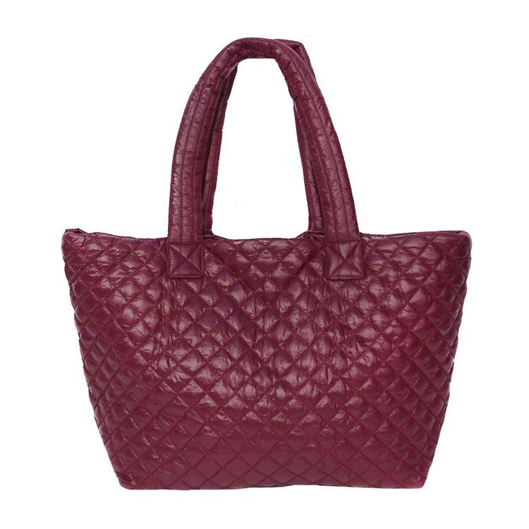 Burgundy Quilted Padded Puffer Tote Bag, has plenty of room to carry all your handy items with ease. Trendy and beautiful bag that amps up your outlook while carrying. Great for different activities including quick getaways, holidays, Shopping, beach, or even going outdoors! This tote bag features a top zipper closure for security that makes your life easier and trendier. Its catchy and awesome appurtenance drags everyone's attraction to you.