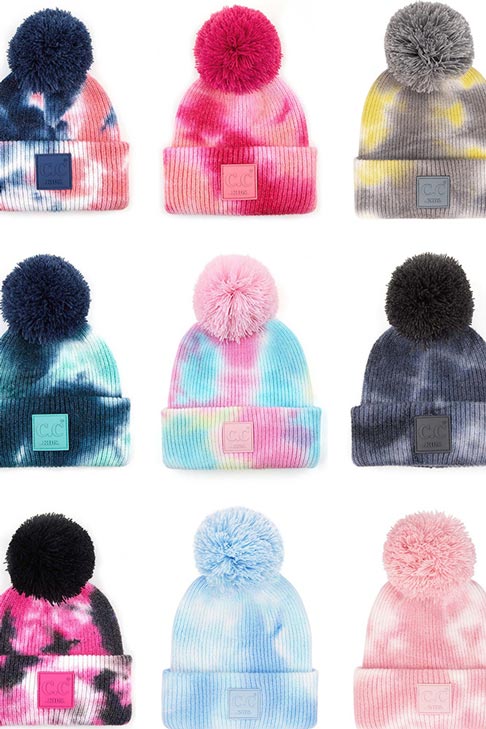 C C Tie Dye Kids Beanie With C C Rubber Patch And Yarn Pom, beautiful tie dye design with yarn pom makes it unique and keeps you standing out with perfect beauty. Wear throughout the winter and cold days to ensure absolute comfortability. Coordinate with any outfit to match the best with perfect warmth and coziness. It Comes in one size winter cap with a pom that fits most head sizes. Enjoy the winter in comfort!