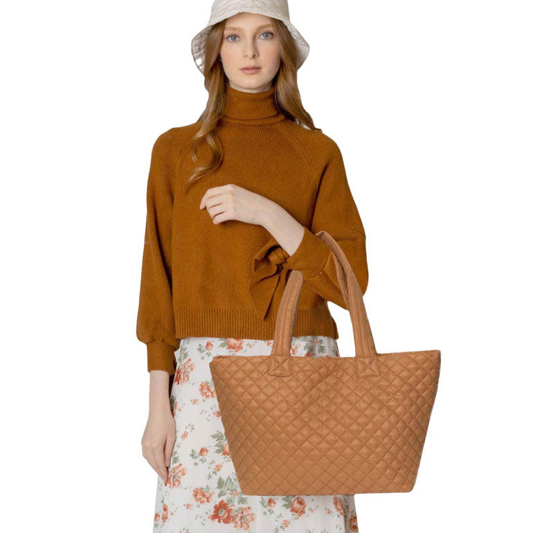 Camel Quilted Padded Puffer Tote Bag, has plenty of room to carry all your handy items with ease. Trendy and beautiful bag that amps up your outlook while carrying. Great for different activities including quick getaways, holidays, Shopping, beach, or even going outdoors! This tote bag features a top zipper closure for security that makes your life easier and trendier. Its catchy and awesome appurtenance drags everyone's attraction to you.