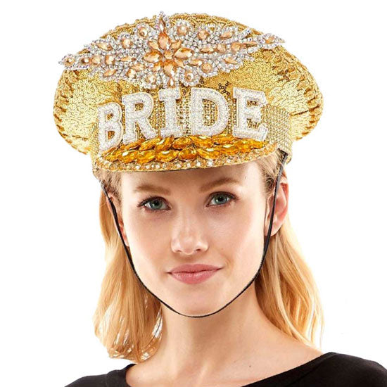 Gold Bride Message Accented Sequin Bling Hat. This visor hat with Bride Tribe Message is Open top design offers great ventilation and heat dissipation. Features a roll-up function; incredibly convenient as it is foldable for easy storage or for taking on the go while traveling. This Summer sun hat is perfect for walking along the beach, hanging by the pool, or any other outdoor activities.