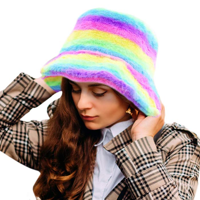 Multi Rainbow Faux Fur Bucket Hat, This Rainbow Faux Fur bucket hat is nicely designed and a great addition to your attire. Have fun and look Stylish anywhere outdoors. Great for covering up when you are having a bad hair day. Perfect for protecting you from the wind, snow, beach, pool, camping, or any outdoor activities in cold weather. Amps up your outlook with confidence with this trendy bucket hat. It's the autumnal touch you need to finish your outfit in style. Awesome winter gift accessory!