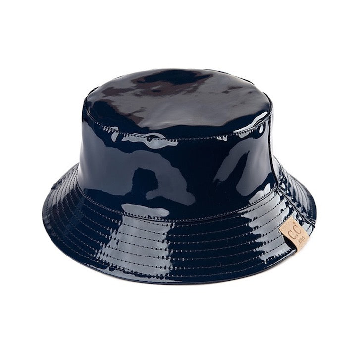 Navy C.C Kids Shiny Solid Color Reflective Enamel Detailed Rain Bucket Hat; this rain hat is snug on the head and works well to keep rain off the head, out of the eyes, and also the back of the neck. Wear it to lend a modern liveliness above a raincoat on trans-seasonal days in the city. Perfect Gift for that fashion-forward friend