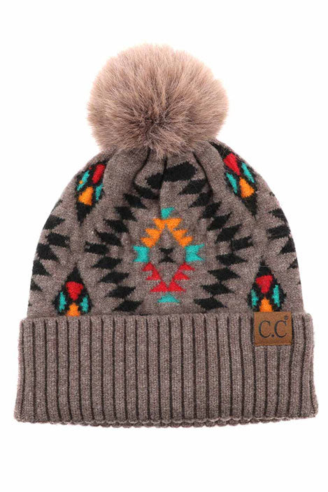 Taupe C.C Soft Aztec Pattern Beanie with Faux Fur Pom, is beautifully knitted with a variety of colors and design that brings a unique look. Coordinate these aztec pattern beannie with any outfit to match the best with absolute warmth and coziness in style. This is an ideal winter head cover that comes in one size winter cap with a faux fur pom that fits most head sizes. Perfect winter gift accessory for your friends, family, and the persons you love.