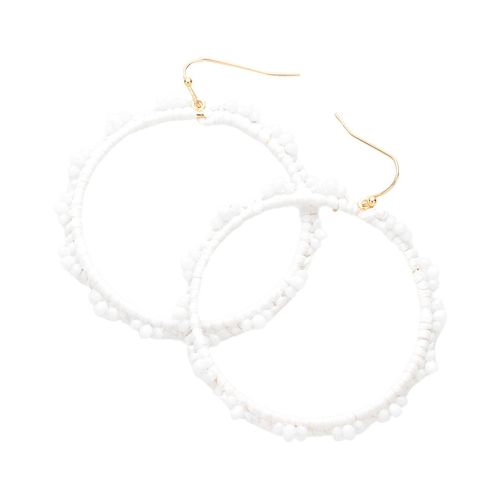 White Beaded Pointed Raffia Wrapped Open Circle Dangle Earrings, enhance your attire with these beautiful raffia-wrapped dangle earrings to show off your fun trendsetting style. It can be worn with any daily wear such as shirts, dresses, T-shirts, etc. These raffia open-circle dangle earrings will garner compliments all day long. Whether day or night, on vacation, or on a date, whether you're wearing a dress or a coat, these earrings will make you look more glamorous and beautiful.
