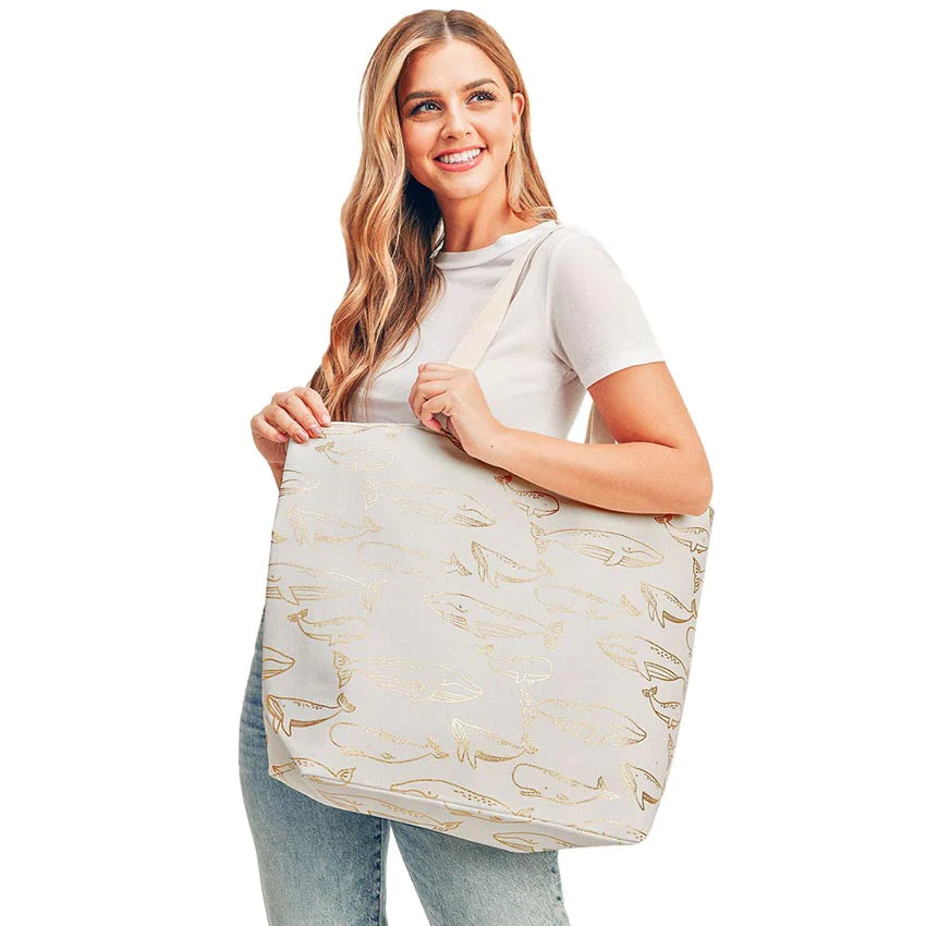 White Metallic Whale Beach Tote Bag, going to the pool or beach, this Whale print tote bag is the perfect accessory. Spacious enough for carrying any and all of your seaside essentials. The soft rope straps really help carry this tie due shoulder bag comfortably. Perfect for carrying books, as a laptop bag, beach carry, or even an everyday bag!