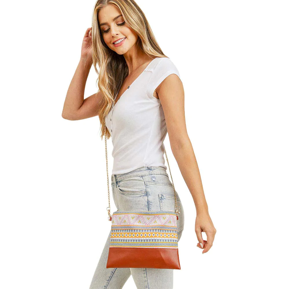 Yellow Aztec Patterned Wristlet Clutch Crossbody Bag, The Crossbody bag with an Aztec pattern that will go with any outfit. It looks like the ultimate fashionista when carrying this Aztec pattern clutch bag, great for when you need something small to carry or drop in your bag. Perfect for makeup, money, credit cards, keys, or coins, comes with a wristlet for easy carrying, light, and simple. Great for running small errands while keeping your hands free. An excellent gift idea for your loved one.
