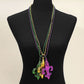 Mult Purple Fleur-de-lis pendant necklace set designed with a bold emblem charm and classic beaded chain for statement appeal. Ideal for celebrations, themed events, parades, and party styling, these necklaces add iconic flair and playful character to outfits while remaining lightweight and easy to wear.