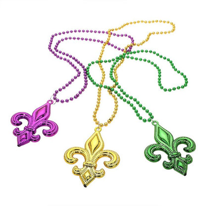 Mult Purple Fleur-de-lis pendant necklace set designed with a bold emblem charm and classic beaded chain for statement appeal. Ideal for celebrations, themed events, parades, and party styling, these necklaces add iconic flair and playful character to outfits while remaining lightweight and easy to wear.