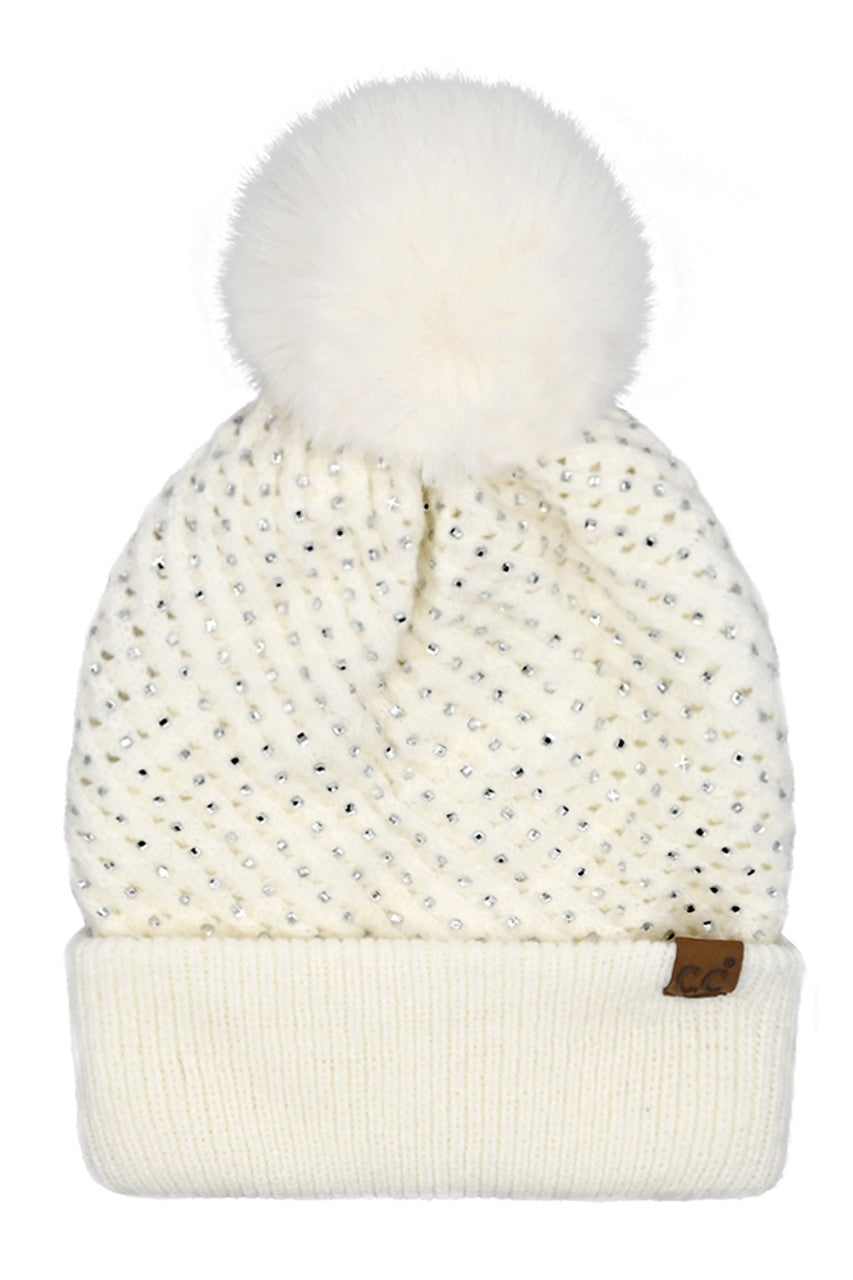 IvoryC.C Allover Rhinestone Pom Beanie combines expert craftsmanship with stylish practicality. Crafted from soft, warm knit material, this beanie is adorned with shimmering rhinestones for an elegant yet understated sparkle. The plush pom on top adds a classic touch while ensuring cozy protection against cold weather. Perfect for elevating your winter wardrobe, it offers a refined blend of comfort, durability, and sophistication. 