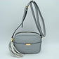 Pebbled Camera Crossbody Bag with Large Statement Tassel Accent - Earth Gray - Crossbody Bags
