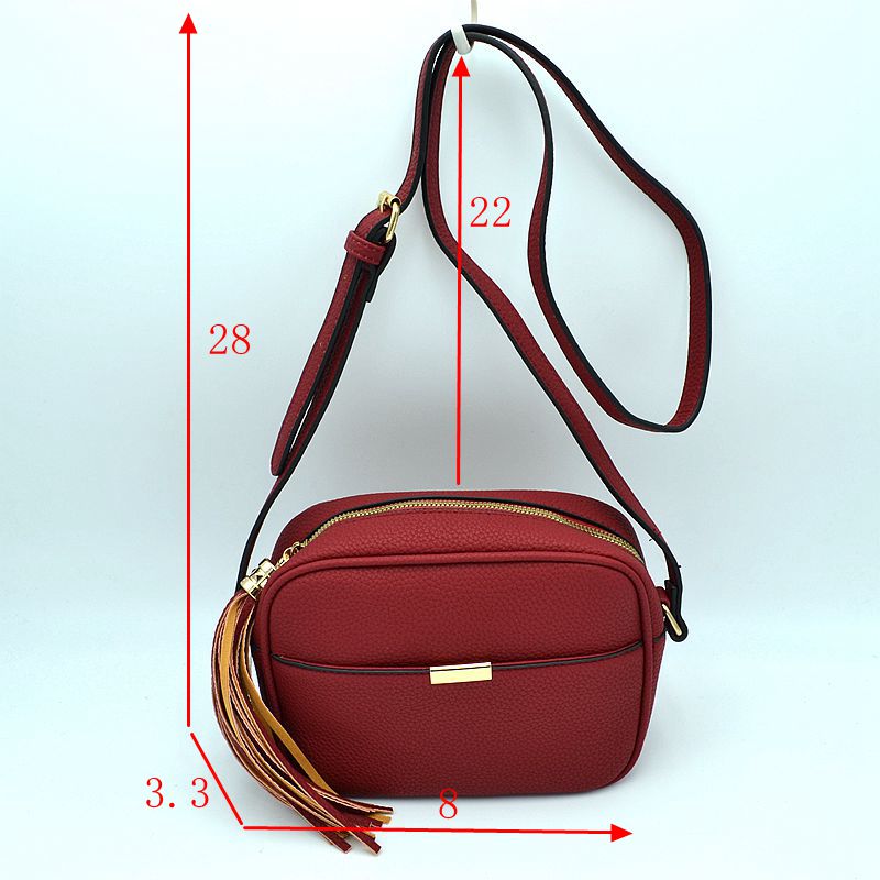 Pebbled Camera Crossbody Bag with Large Statement Tassel Accent - Crossbody Bags