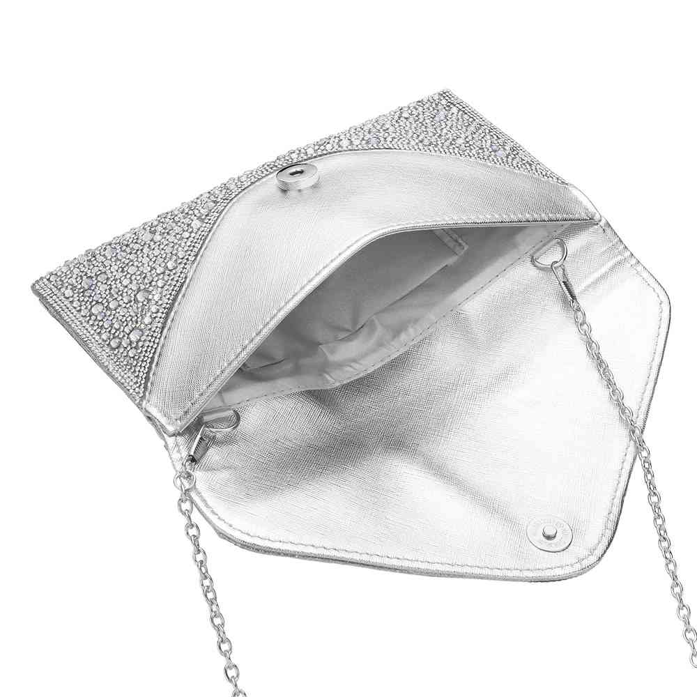 AB Silver Bling Stone Studded Clutch Bag doubles as a crossbody bag as well, making it a versatile and stylish choice for any evening occasion. The bling stones add a touch of glamour, while the flap envelope design keeps your belongings secure. Perfect for a night out, this bag will elevate any outfit.