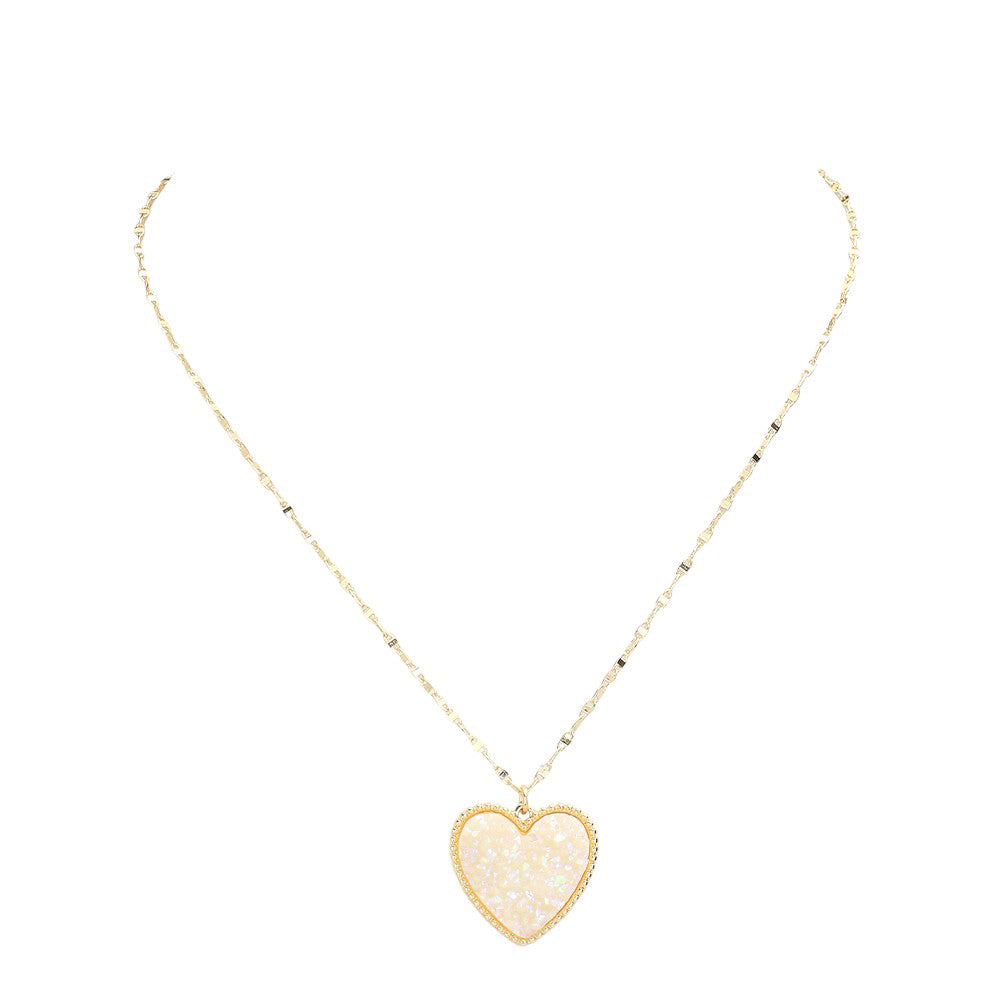 AB White Druzy Heart Pendant Necklace, this is a stunning accessory that adds a touch of sparkle to any outfit. The druzy heart pendant is beautifully crafted and catches the light for a mesmerizing effect. With its unique design and high-quality materials, this necklace is sure to make a statement and elevate your look.