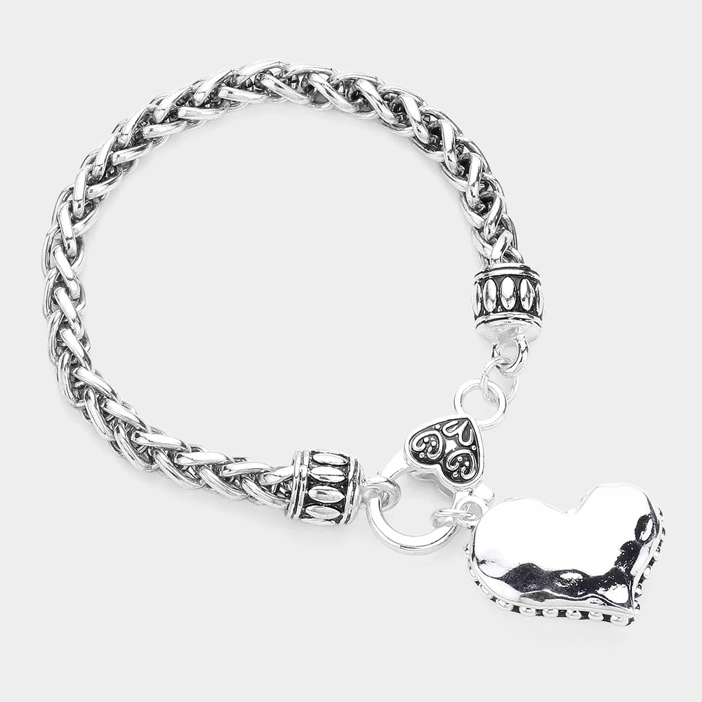 Antique Metal Heart Charm Bracelet is a timeless piece that combines vintage charm with modern style. Crafted from durable antique metal, this bracelet features unique heart-shaped charms that add a touch of elegance to any outfit. Ideal for any occasion, this bracelet is a must-have for any jewelry collection. 