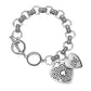 Antique Silver Antique Metal Heart Charm Toggle Bracelet features a timeless design that adds a touch of elegance to any outfit. Made with high-quality antique metal and featuring a heart charm toggle, this bracelet is a must-have for any fashion-forward individual. Its vintage-inspired look is perfect for any occasion, making it a versatile and stylish addition to your jewelry collection.
