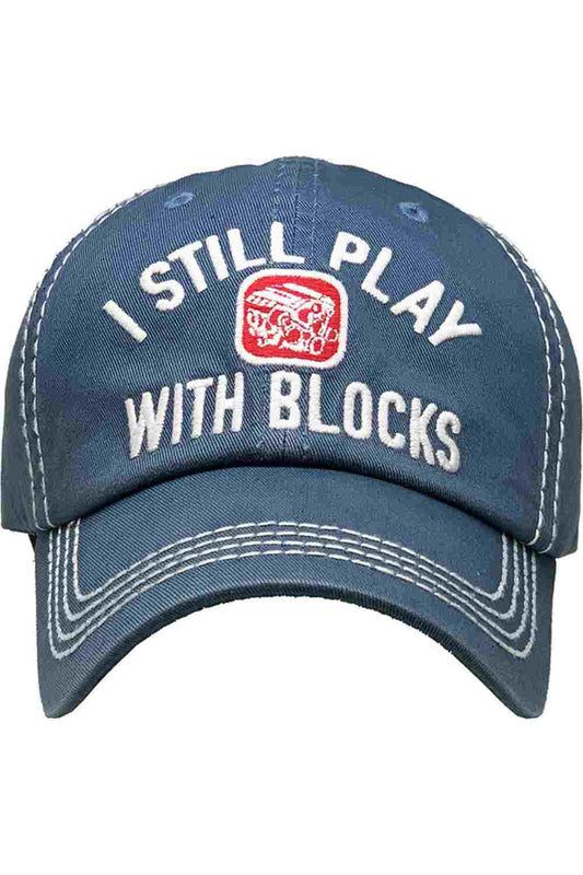 Blue Show off your playful side with the I Still Play Blocks Vintage Baseball Cap, featuring a distressed finish and classic curved brim for effortless everyday style. Made from soft, breathable cotton with an adjustable back strap, this cap offers a comfortable fit while adding a fun retro touch to any casual outfit.