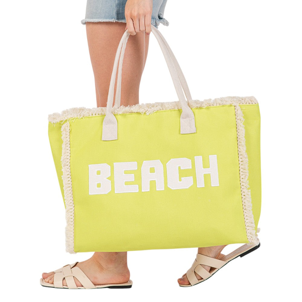 yellow BEACH Message Embroidered Fringe Tote Bag / Beach Bag is perfect for any beach day. With its spacious interior and stylish embroidered fringe detailing, it's both functional and fashionable. Carry all your beach essentials in one convenient and trendy tote. 