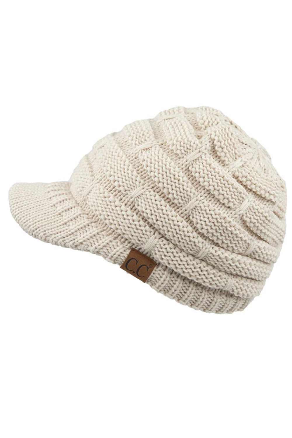 Beige The C.C Ribbed Knit Brim Beanie combines comfort and style in one versatile piece. Made from 100% acrylic, this lightweight beanie features a classic ribbed knit construction with a structured brim for added warmth and coverage. Perfect for casual outings or outdoor activities, it pairs effortlessly with any winter wardrobe.
