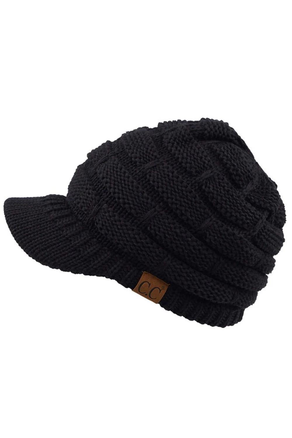 Black The C.C Ribbed Knit Brim Beanie combines comfort and style in one versatile piece. Made from 100% acrylic, this lightweight beanie features a classic ribbed knit construction with a structured brim for added warmth and coverage. Perfect for casual outings or outdoor activities, it pairs effortlessly with any winter wardrobe.