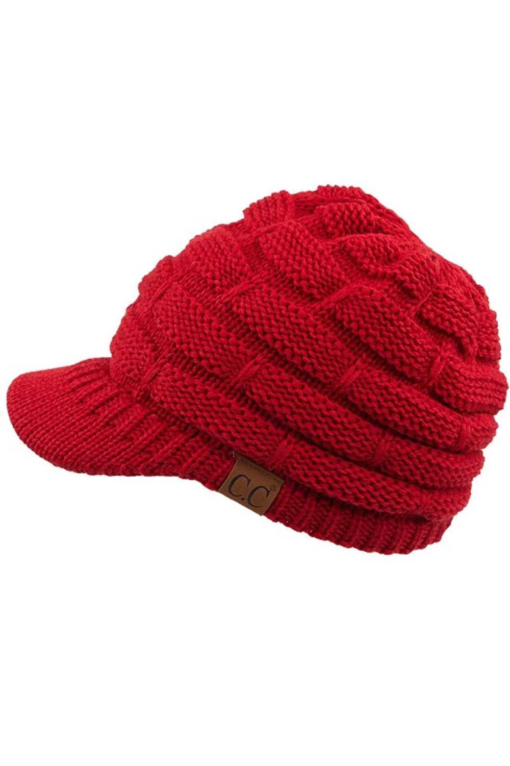 Red The C.C Ribbed Knit Brim Beanie combines comfort and style in one versatile piece. Made from 100% acrylic, this lightweight beanie features a classic ribbed knit construction with a structured brim for added warmth and coverage. Perfect for casual outings or outdoor activities, it pairs effortlessly with any winter wardrobe.