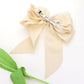 Madeline Love Beige Oversized Pearl Dangle Pointed Bow Barrette - Hair Accessories - desc