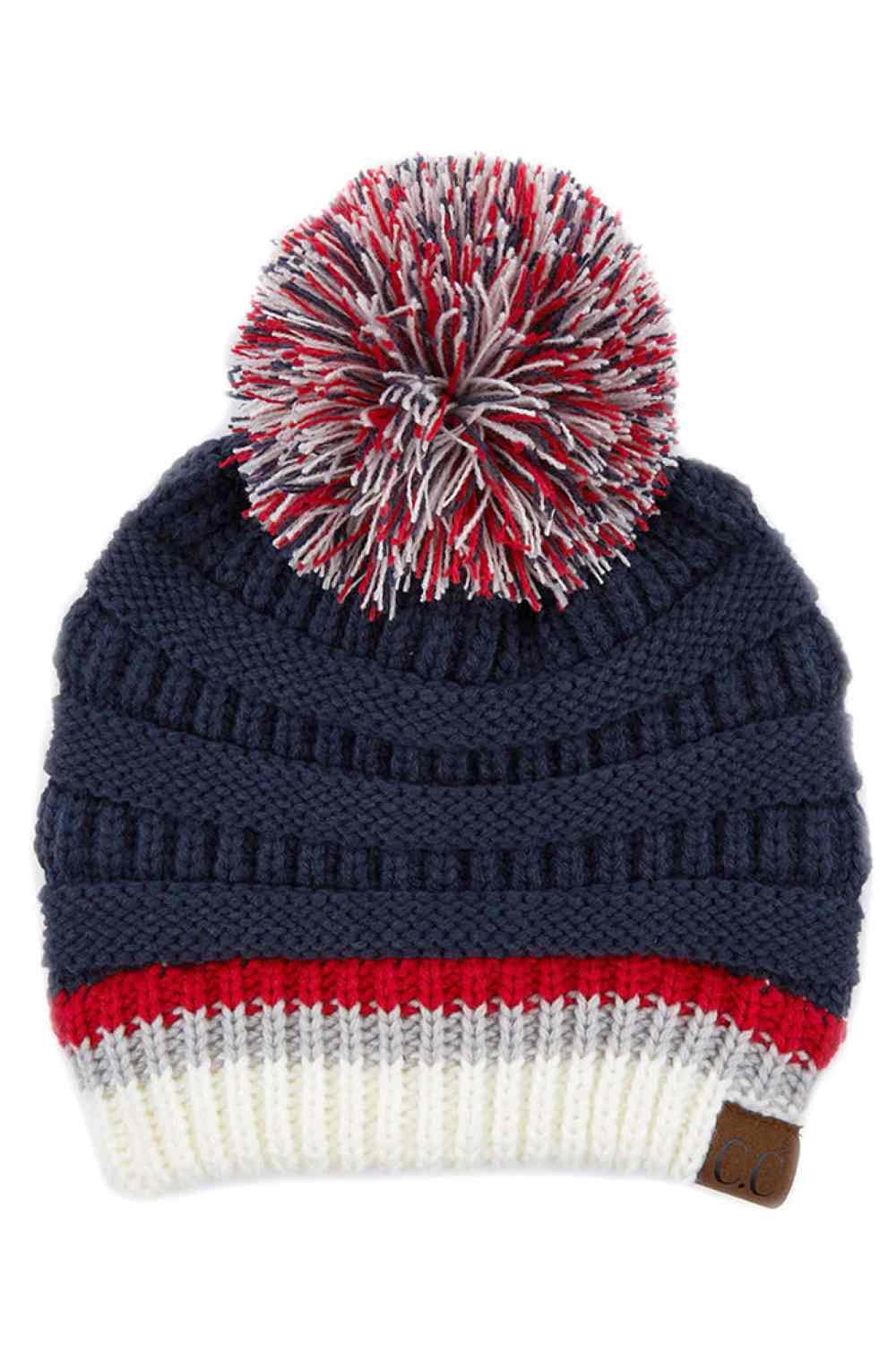 Blue White The C.C Team Color Ribbed Beanie combines style and comfort in one versatile piece. Crafted from 100% acrylic, this beanie features a classic ribbed knit design with a playful pom on top, making it perfect for staying warm during chilly days.