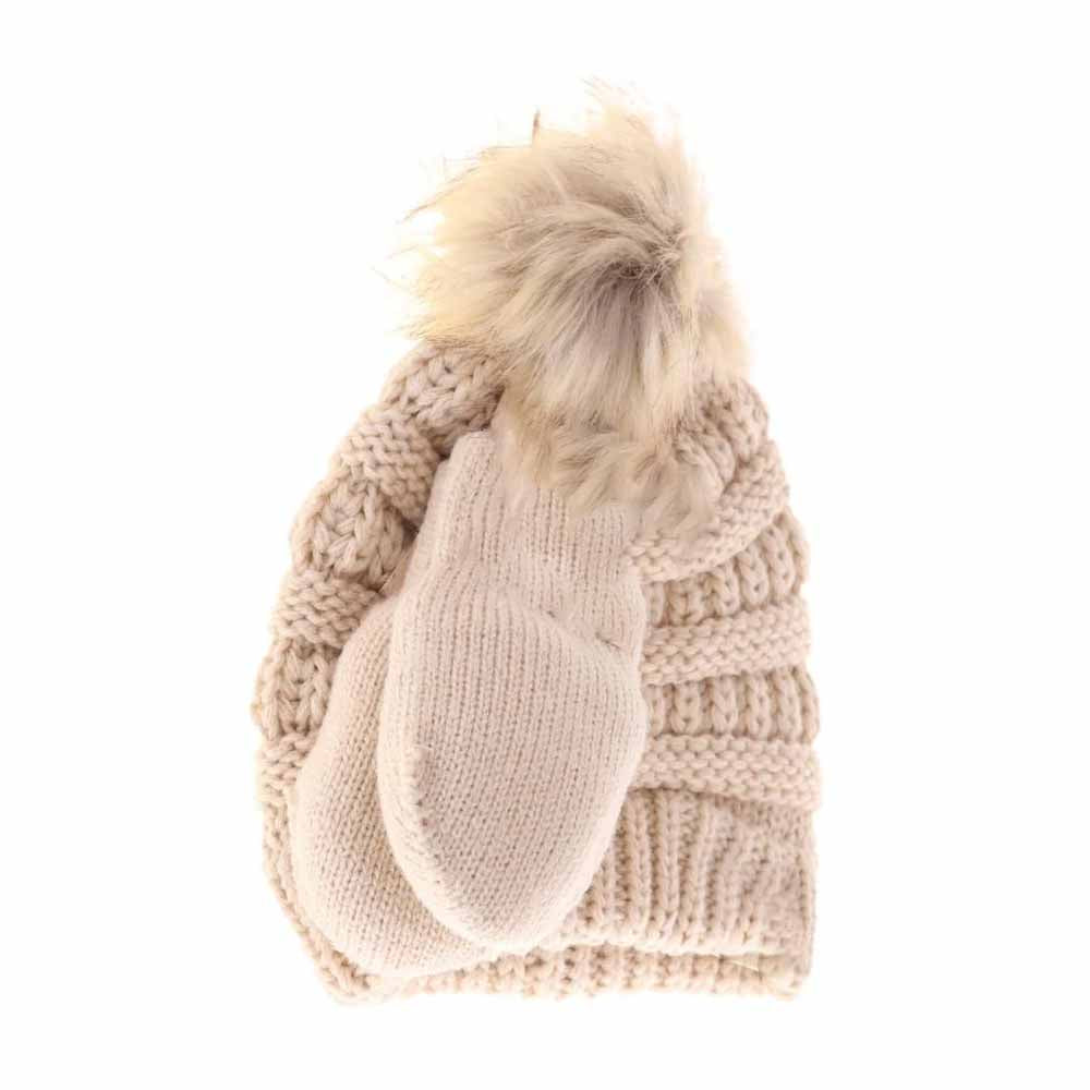 Beige BABY Solid Knit Faux Fur Pom C.C Beanie with Mitten Set combines warmth and style for your infant. Featuring a soft knit construction and a plush faux fur pom, the beanie offers gentle insulation while the coordinating mittens keep tiny hands protected from chilly weather. This set is designed with comfort and durability in mind, providing reliable cold-weather coverage that is both functional and fashionable for everyday use.