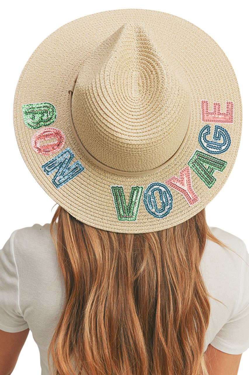 Beige BON VOYAGE Sequin Letter Panama Hat combines sophisticated sun protection with statement style. The premium straw construction features precision-applied sequin lettering that catches the light with every movement. Designed with a classic Panama silhouette and proper ventilation, it offers both UPF protection and breathability for extended outdoor wear. The structured brim maintains its shape while providing optimal face and neck coverage. 