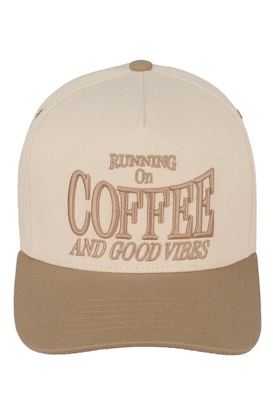 Beige C.C RUNNING ON COFFEE AND GOOD VIBES Trucker Cap is the perfect accessory for any coffee lover. Made from high-quality materials, this cap will keep you stylish and comfortable while you enjoy your favourite caffeinated beverage. With its trendy design and positive message, it's sure to bring good vibes wherever you go.